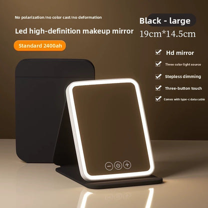 Black high-definition makeup mirror with LED lighting on a brown background