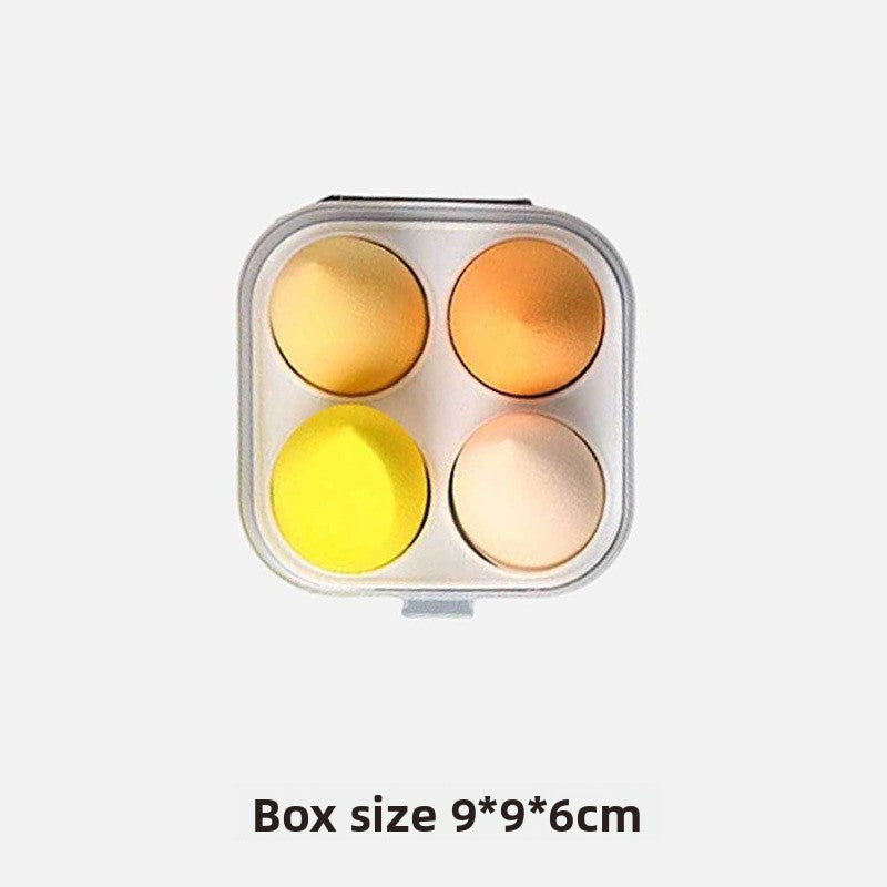 Metallic egg-shaped container with four compartments on a white background