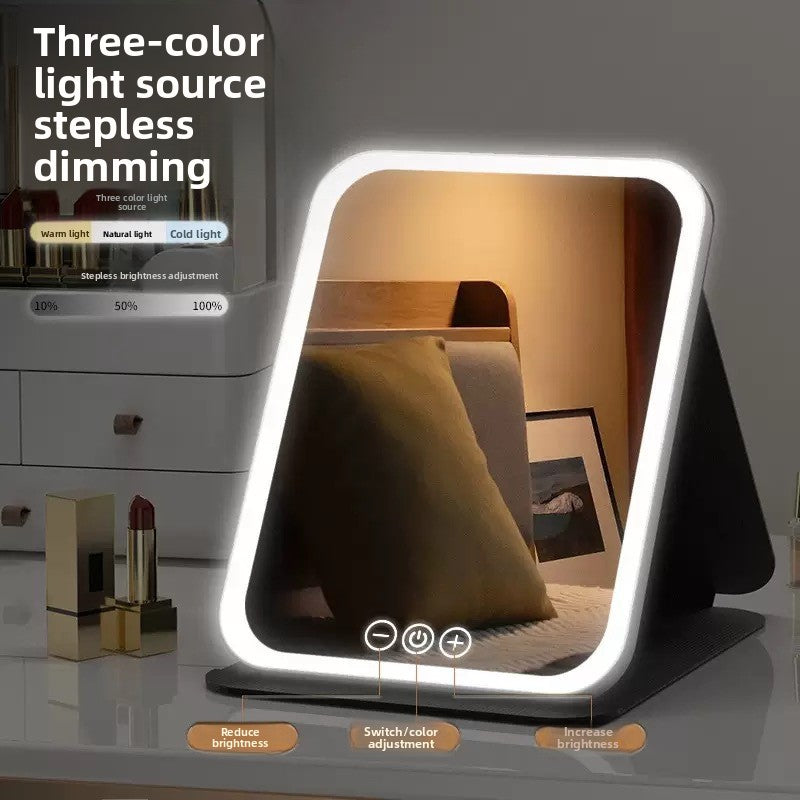 Lighted makeup mirror with three-color light source stepless dimming feature on a blurred background.